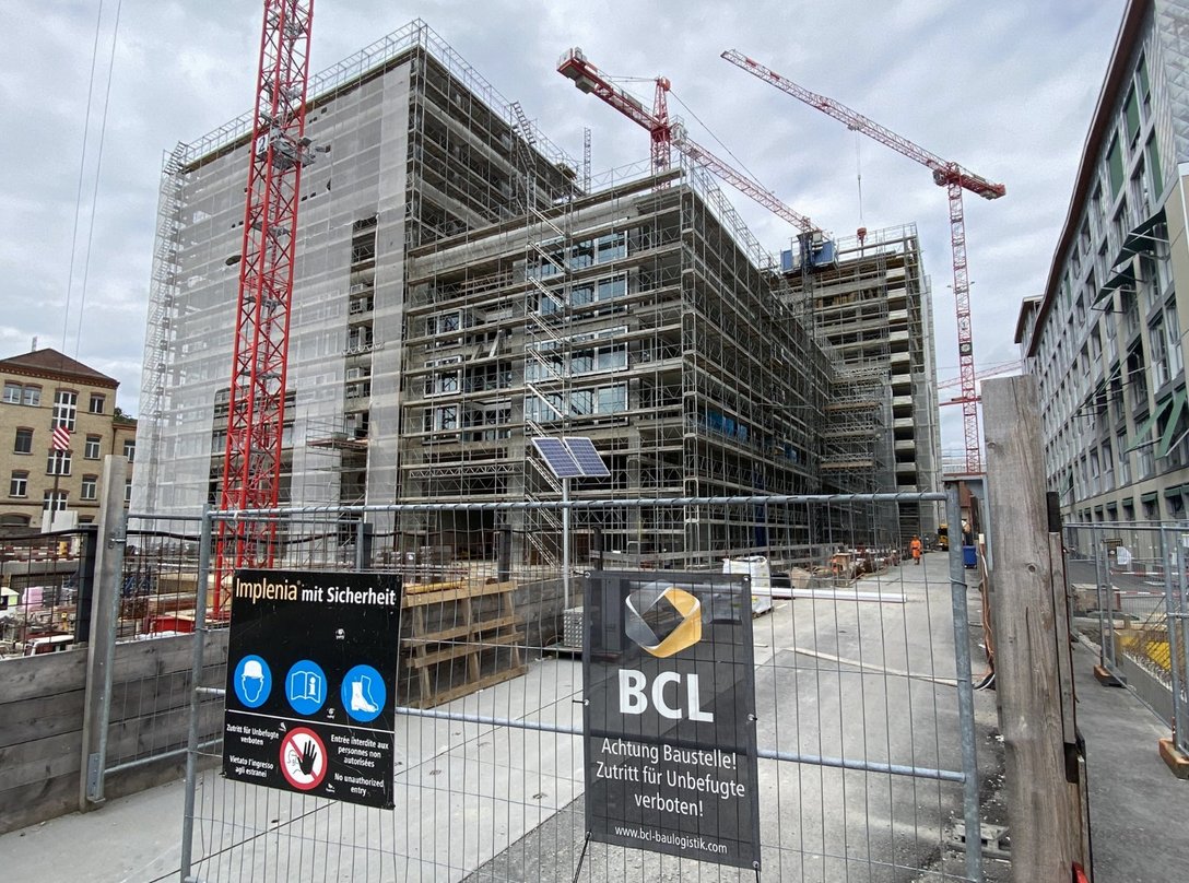 Entrance to the construction site of the Lokstadt area with safety notices in Winterthur, Switzerland